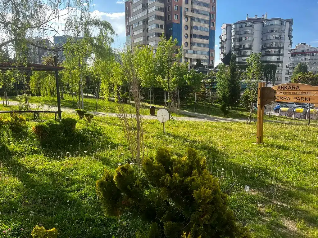 Serra Parkı sign and neighborhood green space in Ankara, Türkiye