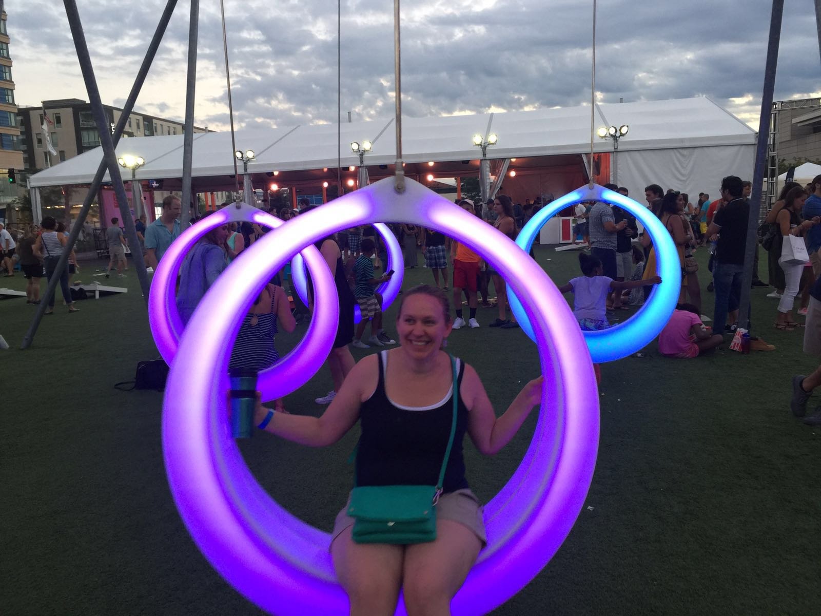 Tiffany sitting on a glowing purple swing at The Lawn on D in 2016 in Boston, Massachusetts