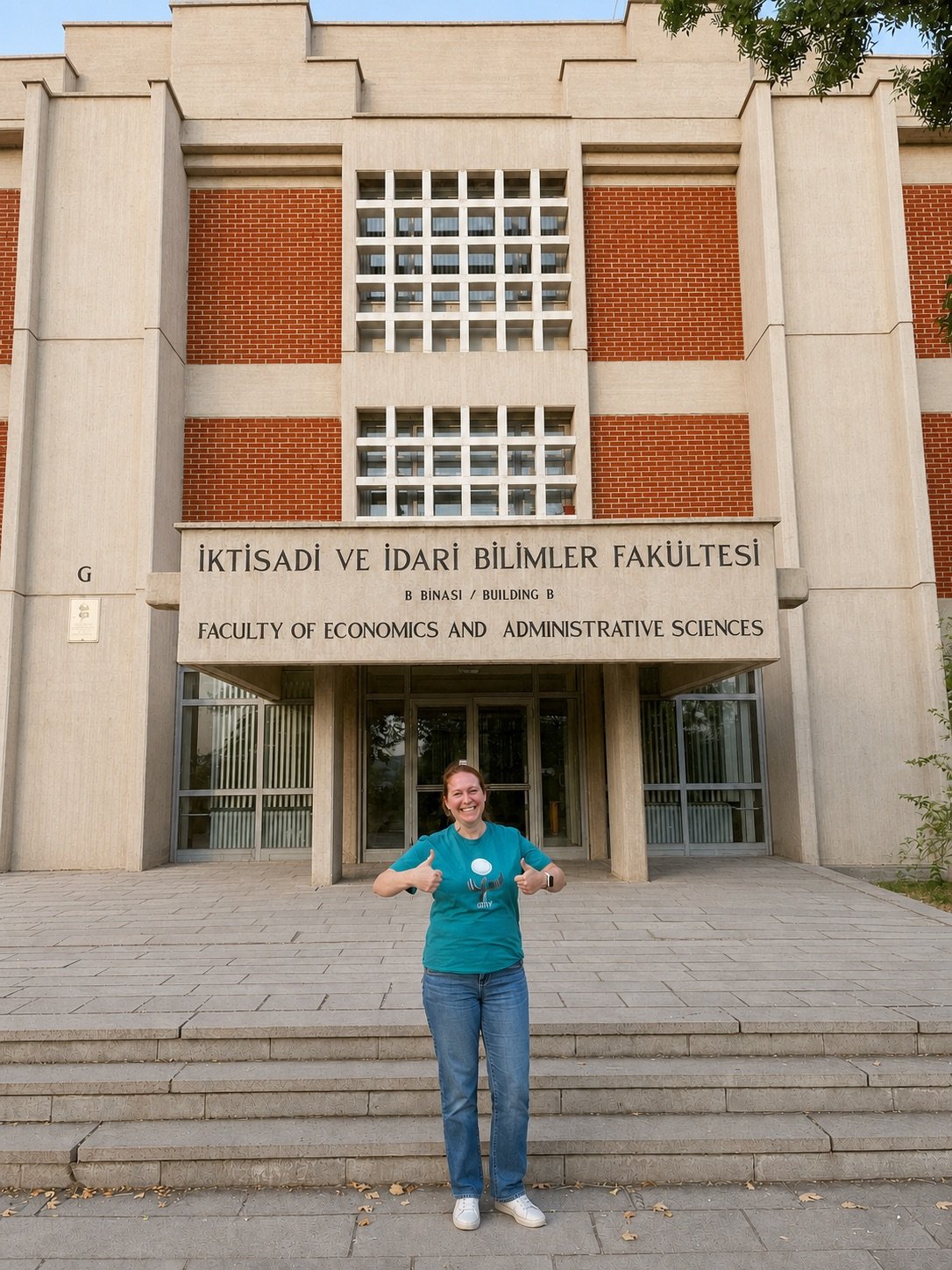 Tiffany gives two thumbs up outside the Faculty of Economics and Administrative Sciences at Middle East Technical University.