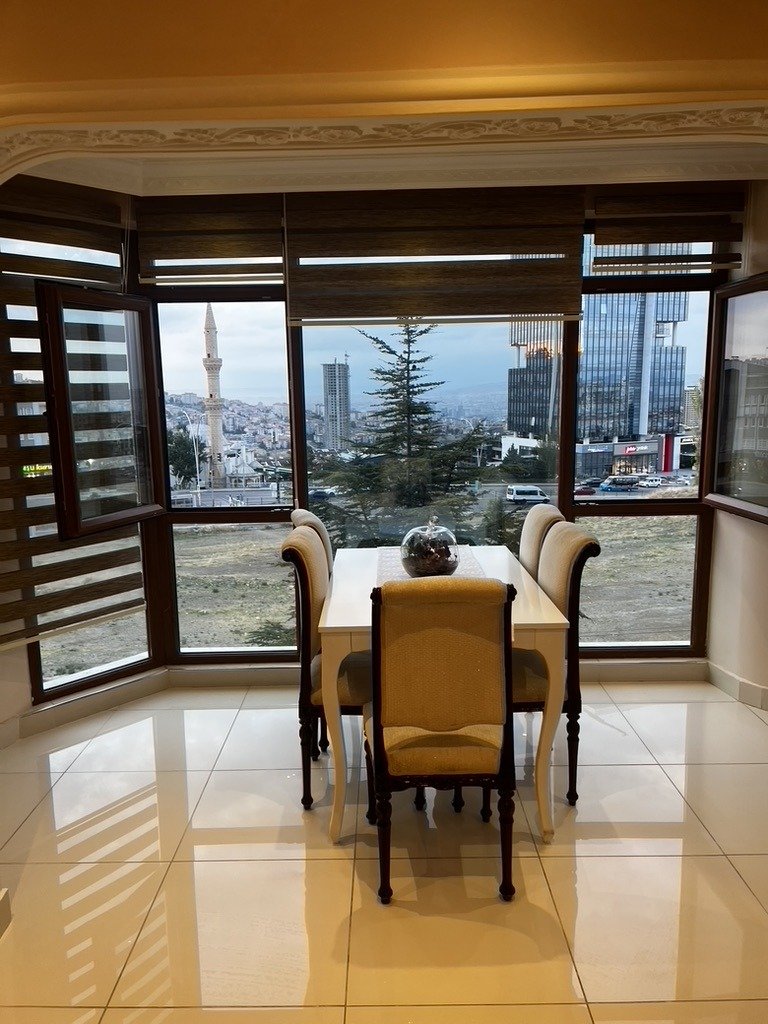 View from the kitchen of my first apartment in Ankara, Türkiye, overlooking the city and a nearby mosque.