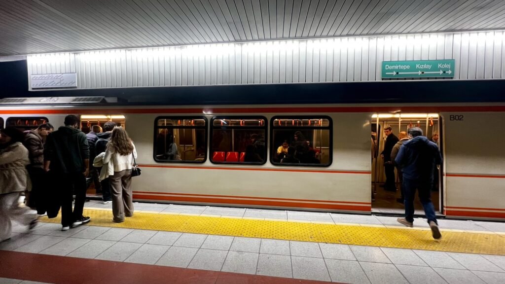 Passengers boarding an Ankaray light-rail train at Kızılay station in Ankara, Türkiye.