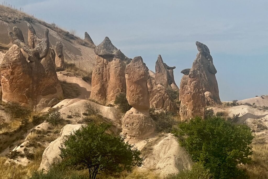 Unusual naturally sculpted rock formations across Devrent Valley in Cappadocia, Türkiye.